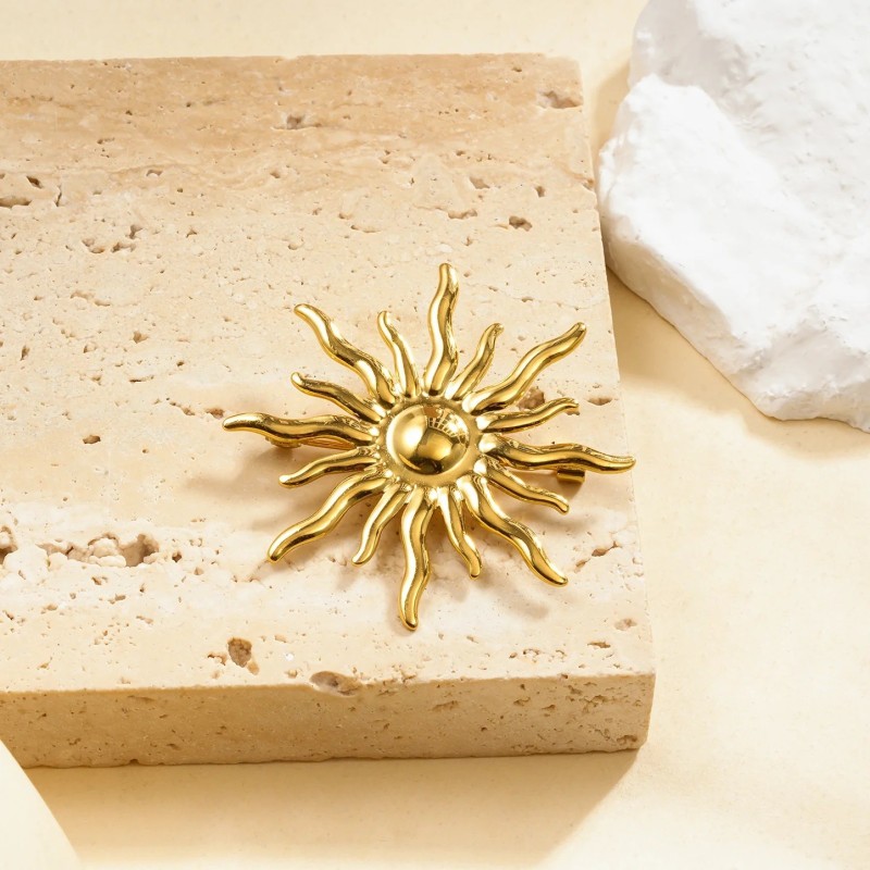 Broche doré soleil rayonnant bombé effet miroir